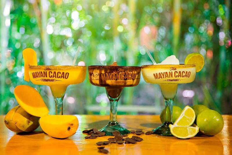 Cozumel: Chocolate Margarita Workshop with Mayan Recipe - Grinding cacao beans by hand